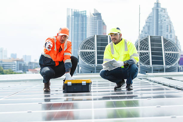 Amber Solar engineers inspecting rooftop array