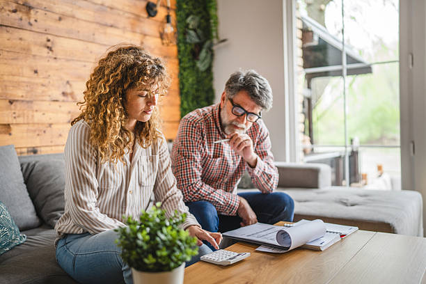 Family reviewing energy bills with calculator