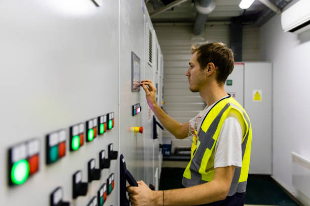 Technician performing O&M on panels